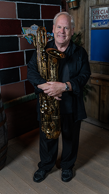 Greg Keel plays baritone saxophone for the Good Bad and the Funky