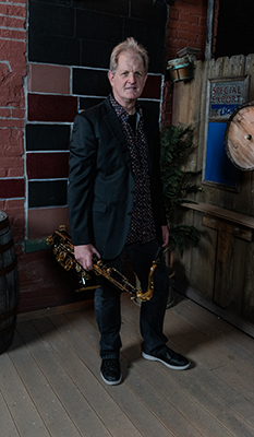 Layne Bender plays saxophone for the Good Bad and the Funky